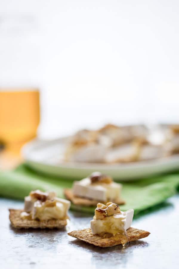 Brie Honey and Walnut Bites, Just 3 simple toppings on a Triscuit cracker for an easy, sweet and savory appetizer or snack.
